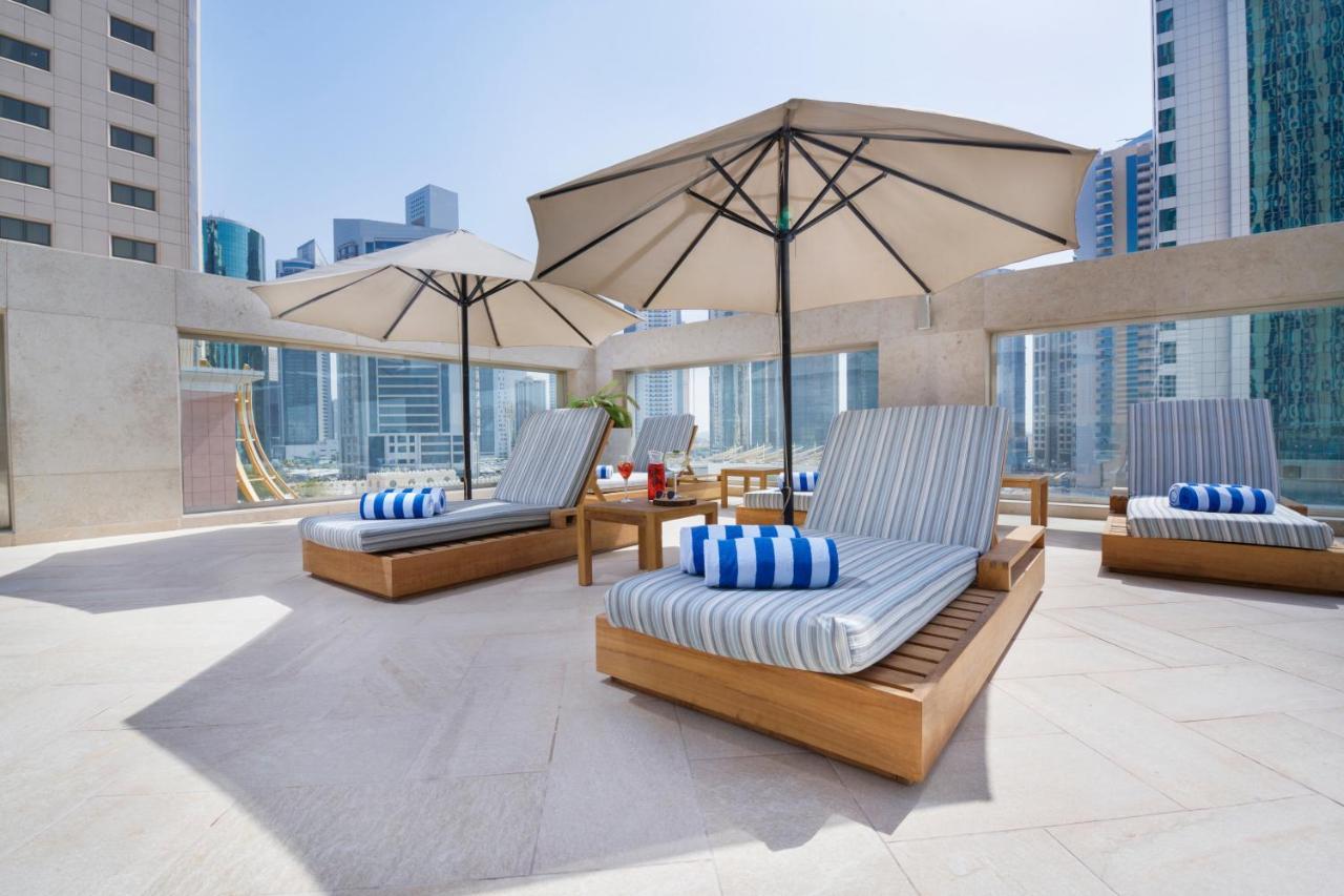 Wyndham Grand Doha West Bay Beach Екстер'єр фото The pool deck at the hotel